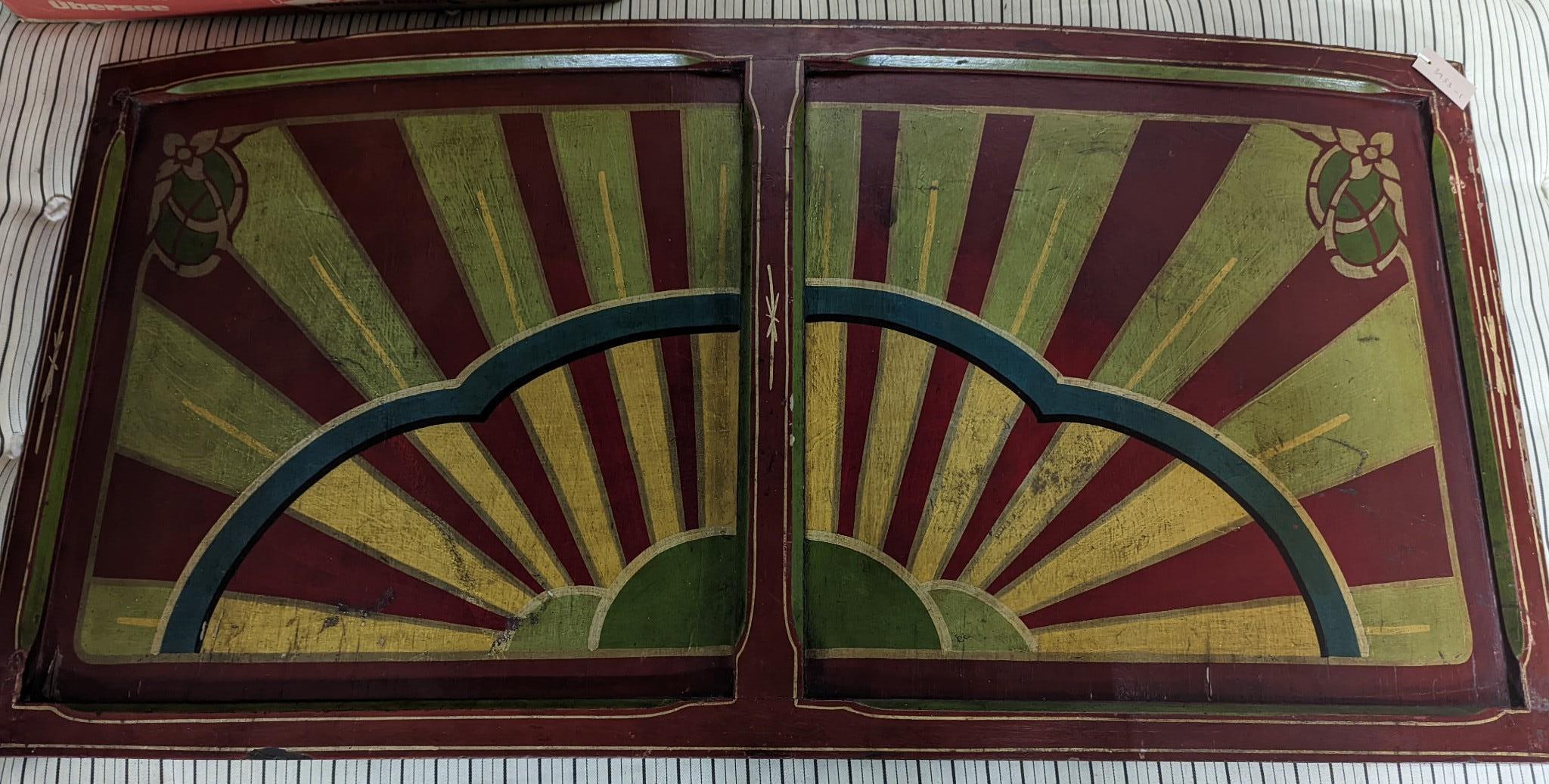 An early 20th century painted wood fairground panel, width 146cm, height 71cm